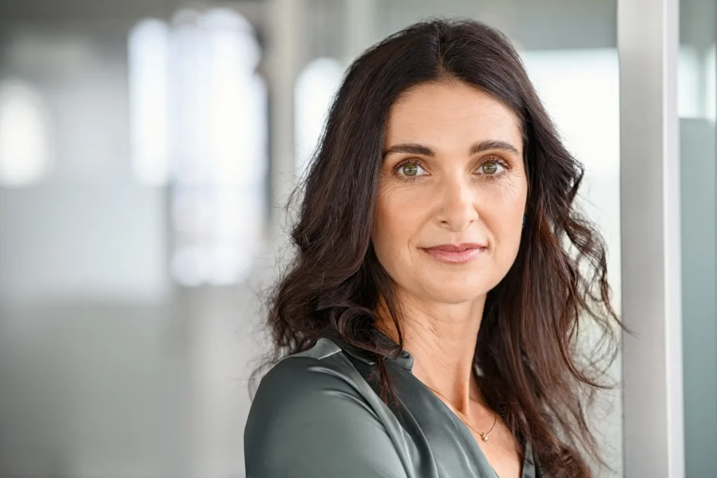 Successful mature business woman looking at camera